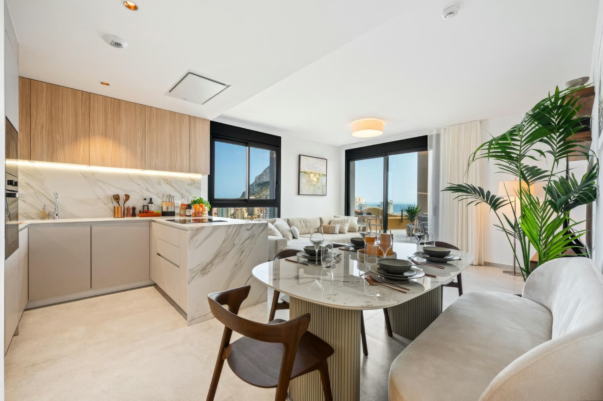 A kitchen and dining area in a Calpe apartment, laid and ready for guests