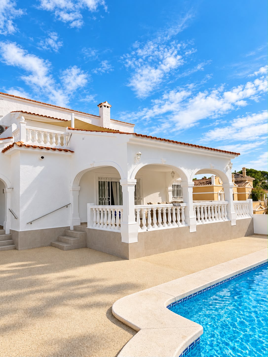 The arched porch, with the pool in front of it